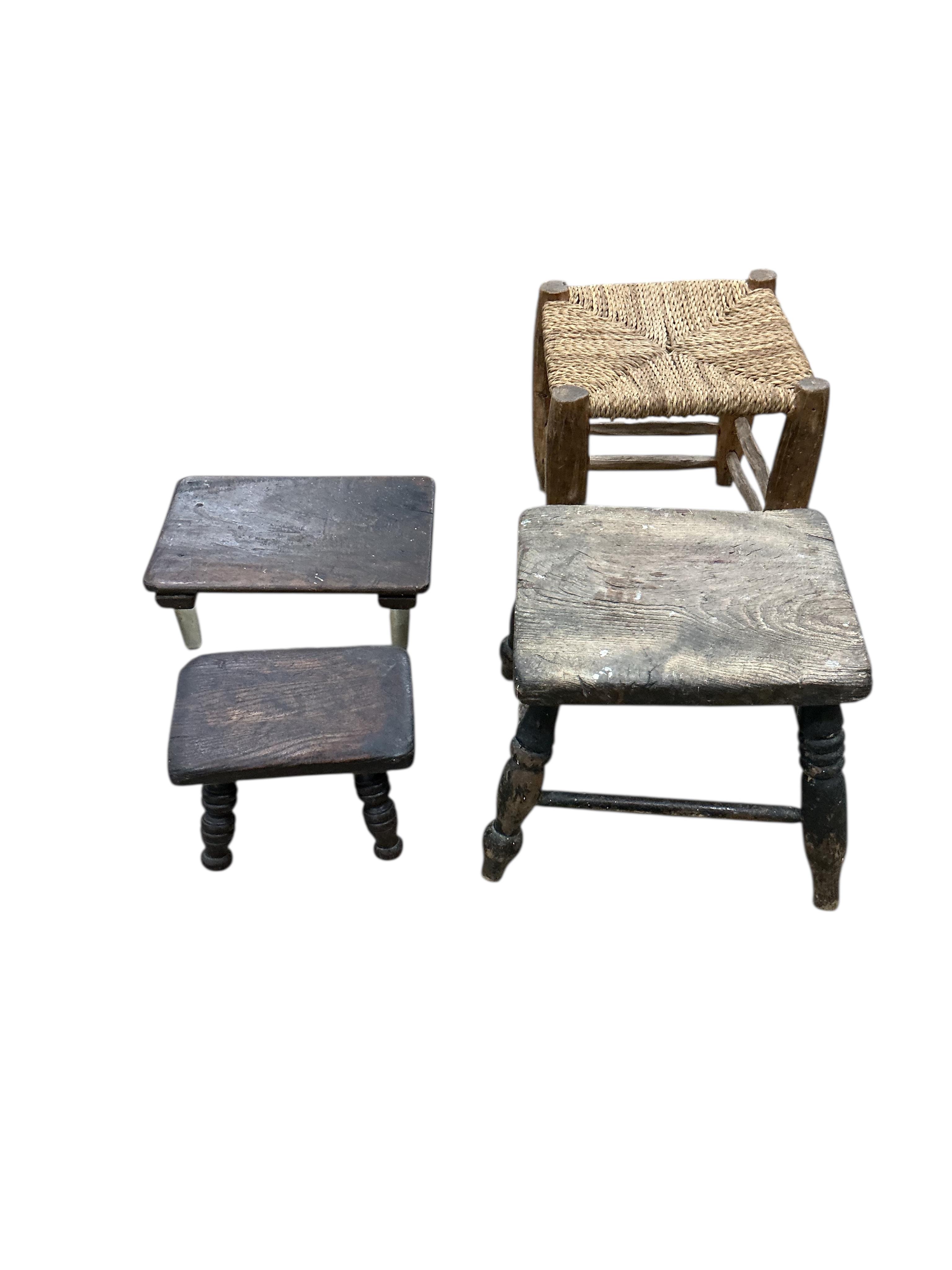 Four 19th century Provincial stools, together with two glass legged stands and an iron trivet